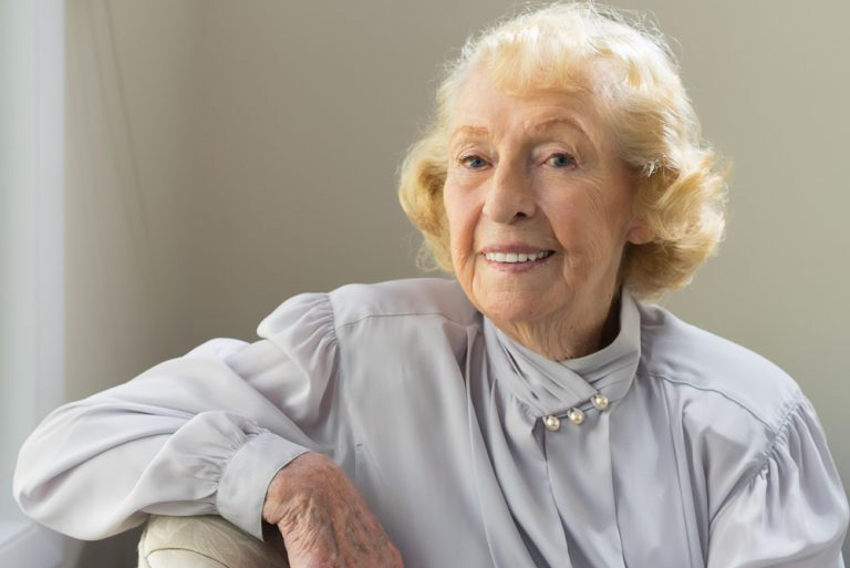 Headshot of Barbara Restle. She wears a light blue blouse.