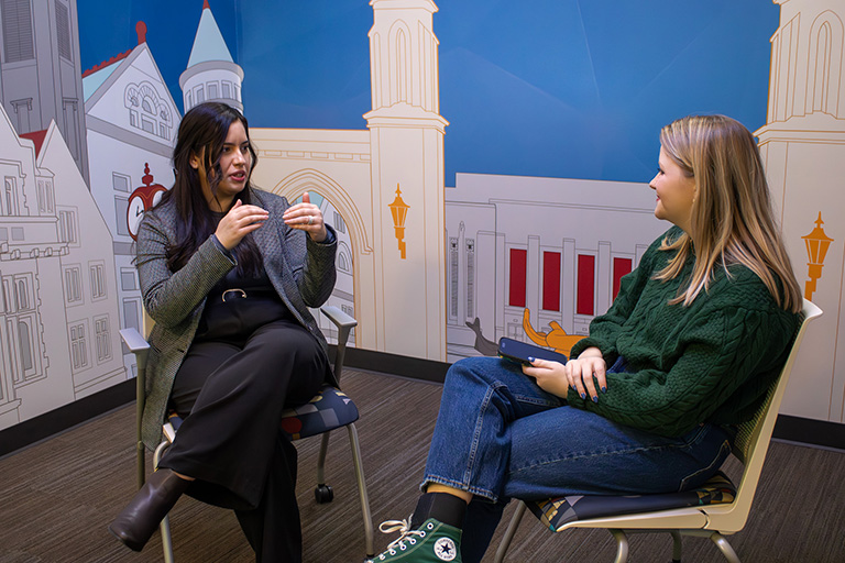 Daniela Molina sits and talks to Emerson Elledge.